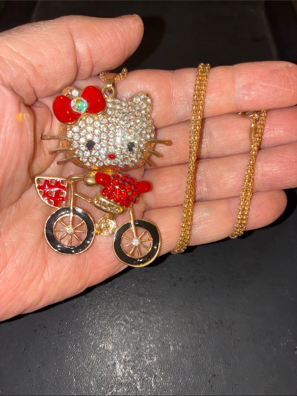 Red Bow Hello Kitty Riding A Bicycle Pendant Necklace with Clear & Red Crystals